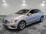 the mercedes b - class is parked on a checkered floor