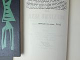 an open book with a green design on it