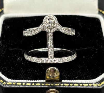 an image of a diamond ring in a black box with a gold ring