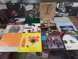 a lot of vinyl records on a table in a room
