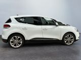 the rear end of a white renault c - cross parked in a room