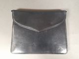 silver leather clutch bag with a zipper closure