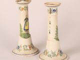 two vases that have been painted with flowers on them