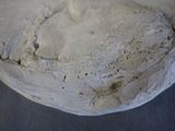 a close up of a piece of bread on a table