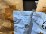 a bag of food that has been wrapped in brown paper