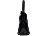 the black purse is sitting on a white surface with a white background