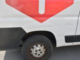 a white van with a red stop sign on the side of it