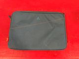 a black laptop bag sitting on top of a red table