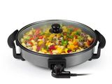 a close up of a pan with vegetables in it on a white surface