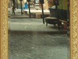 a picture of a mirror in the middle of a room