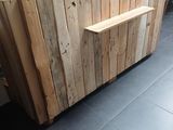 a picture of a wooden counter in a restaurant