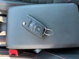 a close up of a car seat with a car key on it