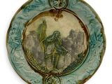 a plate with a picture of a man on a horse on it