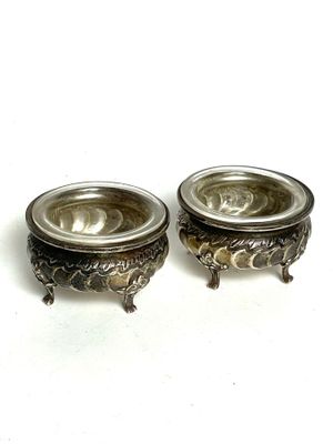 pair of antique silver plated candlesticks with floral design