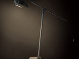 a lamp that is on top of a table in the dark