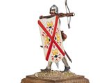 a figurine of a knight holding a sword and shield