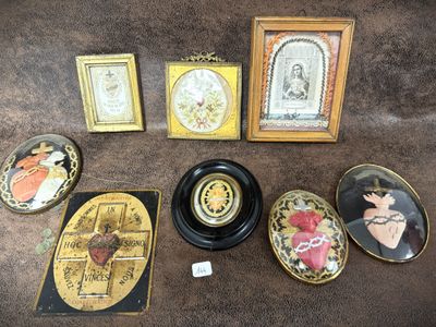 a lot of pictures and a clock on the table