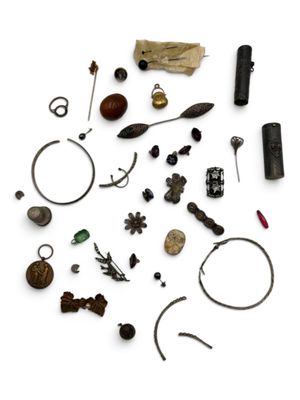 an image of a collection of various metal objects on a white surface