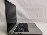 an open laptop computer sitting on top of a white table