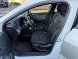 the interior of a car with the door open and the driver ' s seat down