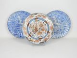 two plates with blue and orange designs on them