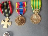 several medals and medals are laying on a table