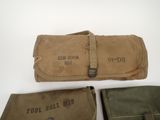 three wwii era canvas tool roll bags, including one with the words ' tool roll moo ' and one with the word ' tool roll moo moo mo