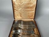 a case with a set of silverware in it
