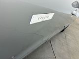 a silver car with a sticker on the side of it