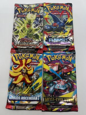 four packs of pokemon trading cards