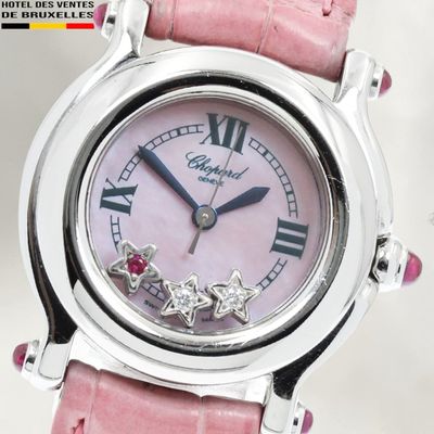 a pink watch with roman numerals on the face