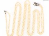 three pearl necklaces with a clasp and clasp