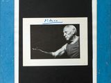 a black and white photo of a man holding a tennis racquet