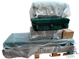 several pieces of luggage sitting on top of a pallet covered in plastic