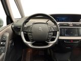 the interior of a car with a steering wheel and dashboard controls
