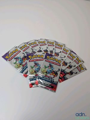 a bunch of pokemon cards sitting on top of a table