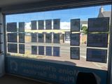 a large window that has a lot of signs on it