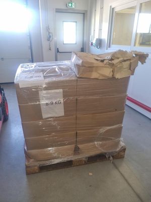 a pallet of cardboard sitting in the middle of a room