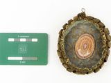 a picture of a medal and a credit card next to each other