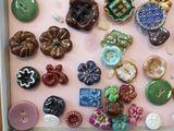 a picture of a box of buttons and buttons