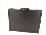 a black briefcase sitting on a white surface