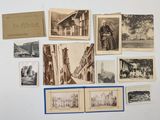 many old photographs of people and buildings on the wall
