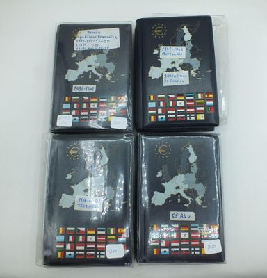 four passport covers with flags and a map of the world on them