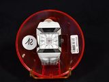 a watch that is sitting on top of a glass plate