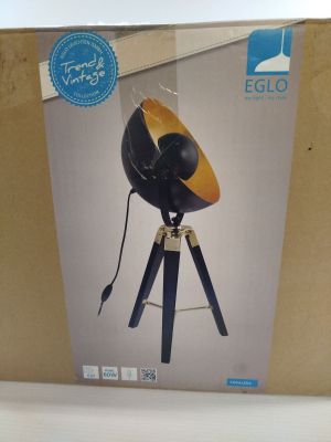packaging of a black and gold lamp on a tripod stand