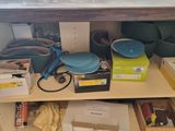 many items on the shelves of a kitchen cupboard