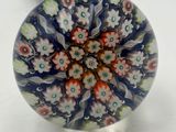 glass knob with a floral design on it on a white surface