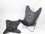 black leather butterfly chair and footstoe with a black leather cover