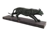 statue of a black cat on a marble base