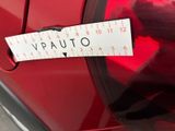 a sticker on the side of a red car that says auto